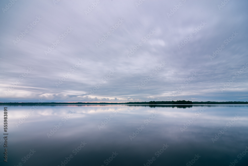 Cloudy morning over lake in summer