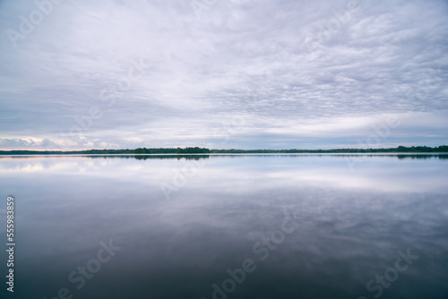 Cloudy mornimg over lake in summer
