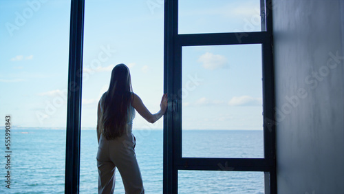 Lonely woman thinking problems at panorama window. Upset businesswoman crying © stockbusters