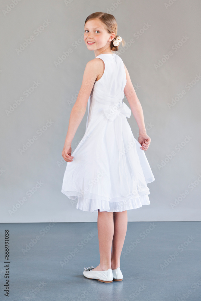 Girl Wearing White Dress in Studio