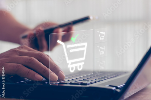 Online shopping concept. shopping order in online store, payment makes a purchase on the Internet, Online payment, Business financial technology. concept on virtual screen with hand typing on keyboard photo