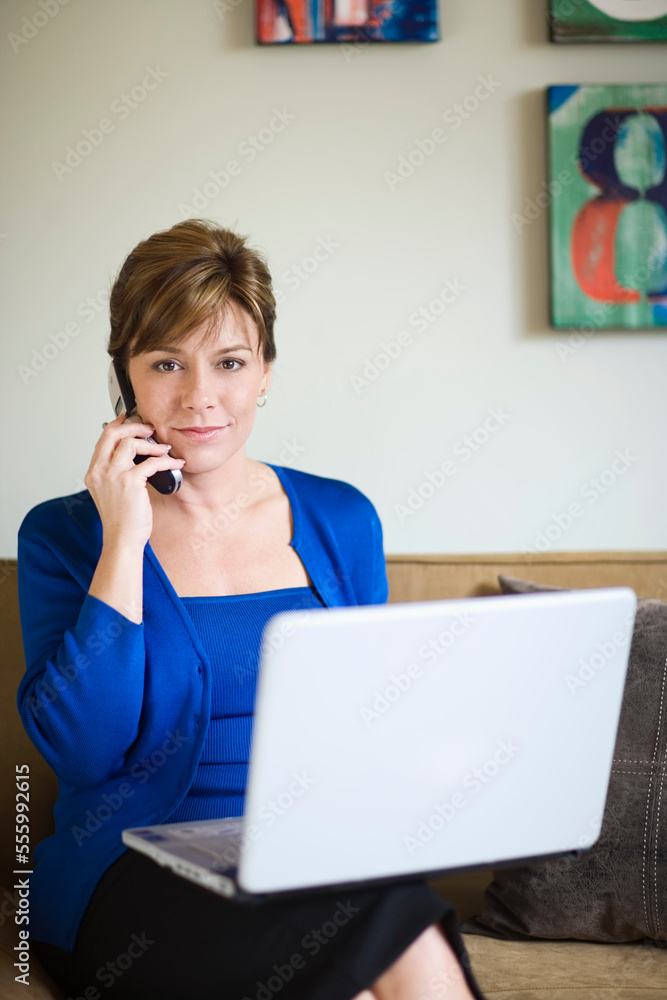 Businesswoman with Cellular Phone and Laptop Computer Businesswoman with Cellular Phone and Laptop Computer