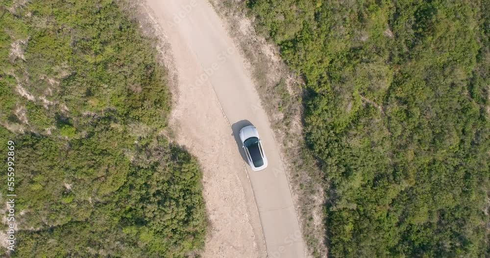 Aerial view of a sport car driving in a woodland, Carmel Forest, Haifa, Israel Aerial view of a sport car driving in a woodland, Carmel Forest, Haifa, Israel