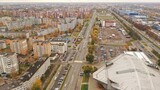 Panoramic bird's eye view of Brest in Belarus. Outskirts of Brest. Brest from above. Eastern Europe in autumn at rainy time. Gray and orange city.