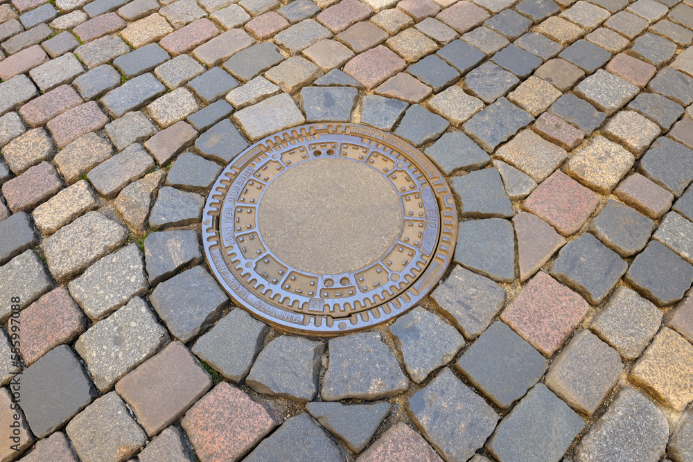 Cobblestone with Manhole Cover, Dresden, Saxony, Germany Cobblestone with Manhole Cover, Dresden, Saxony, Germany