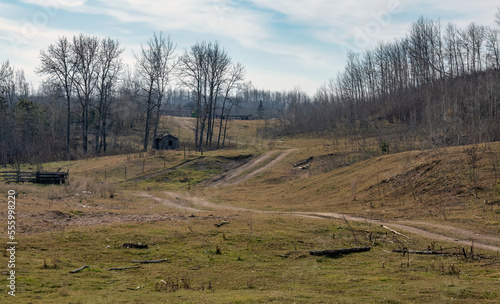 Fototapeta Naklejka Na Ścianę i Meble -  Pasture land in the hills with a dirt trail.