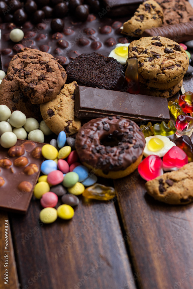 Fototapeta premium Candies, jelly, chocolates, biscuits and doughnuts
