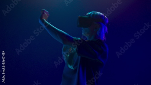Involved guy visit virtual party closeup. Man immersed in abstract neon vr world © stockbusters