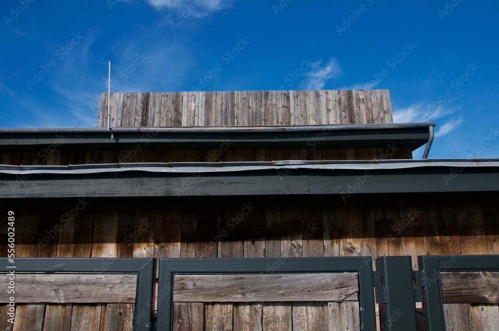 Faded old wood building against dark blue sky Faded old wood building against dark blue sky