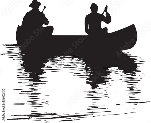 Silhouette and reflection of two boys paddling a canoe on a lake at sunset