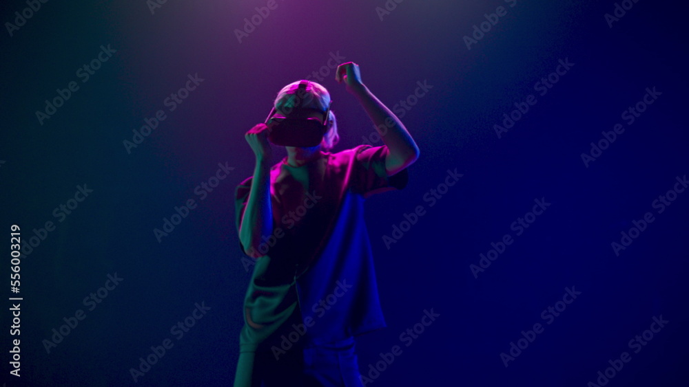 Fototapeta premium Man gaming moving in invisible space using VR. Future and entertainment concept