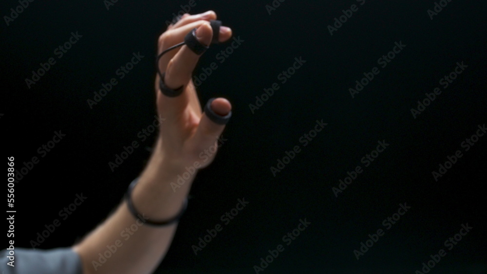 Fototapeta premium Haptic sensors gamer arms touching interface closeup. Man enjoying metaverse