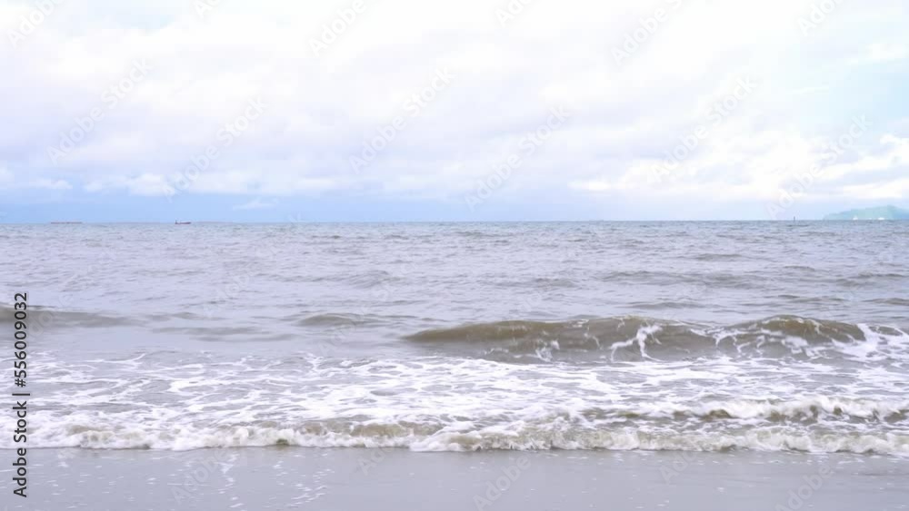 Tropical Beach Ambience on Island in Thailand with Ocean Sounds, Blue cloudy sky tropical Sea beach, view of Sea waves break on tropical white sand beach. Tropical Beach Ambience on Island in Thailand with Ocean Sounds, Blue cloudy sky tropical Sea beach, view of Sea waves break on tropical white sand beach.