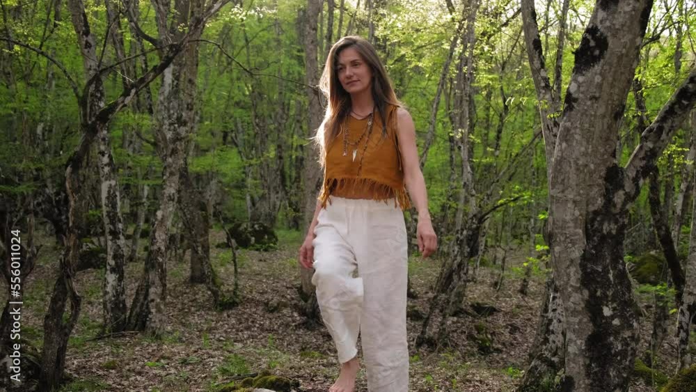 Girl walks in park connecting with nature. a girl walks through the forest enjoying nature. A girl goes on camera in a beautiful forest. reconnecting with nature.hiking woman walk in rainforest jungle Girl walks in park connecting with nature. a girl walks through the forest enjoying nature. A girl goes on camera in a beautiful forest. reconnecting with nature.hiking woman walk in rainforest jungle