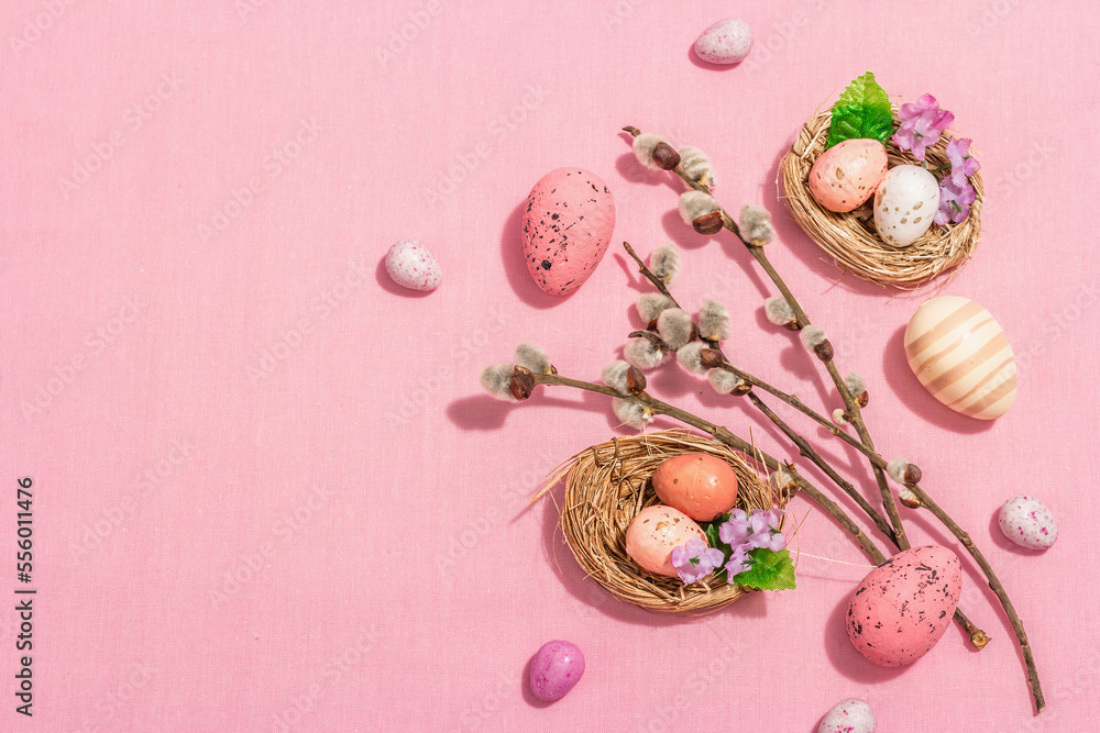 Traditional Easter composition - eggs, bird's nests, willow twigs, themed decor. Pink background Traditional Easter composition - eggs, bird's nests, willow twigs, themed decor. Pink background