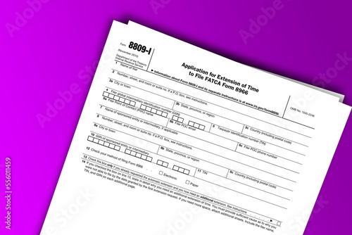Form 8809-I documentation published IRS USA 11.17.2015. American tax document on colored © dmitriy