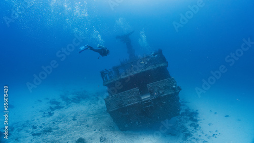 Obraz na plátně scuba diver swimming into a deep wreck