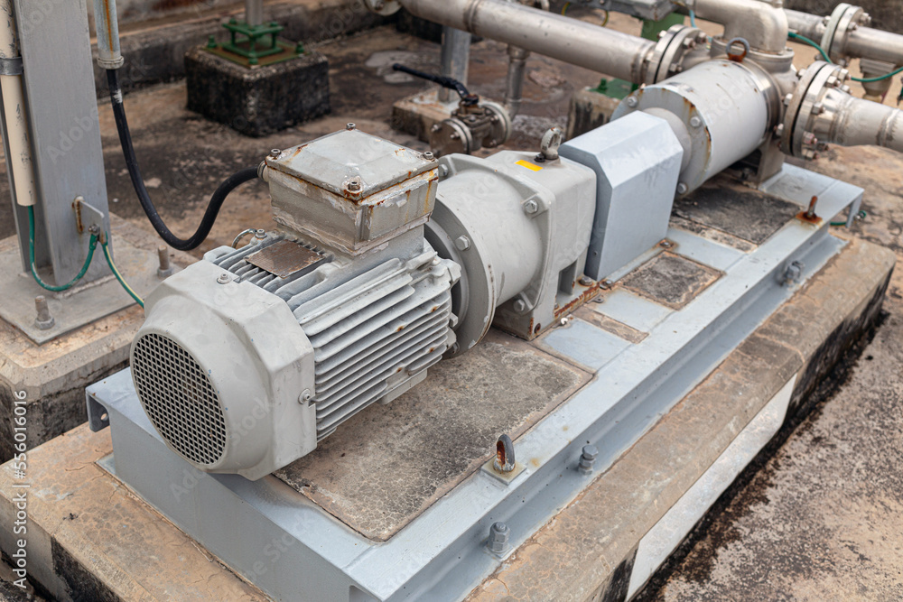 a centrifugal pump installed in an oil refinery or chemical facility and driven by an electric motor. Utilized in industrial Factory to convey liquids to various factory production units. a centrifugal pump installed in an oil refinery or chemical facility and driven by an electric motor. Utilized in industrial Factory to convey liquids to various factory production units.