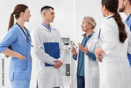 Team of doctors having discussion in clinic photo