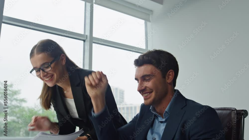 Office team celebrating success closeup. Cheerful colleagues making high five Office team celebrating success closeup. Cheerful colleagues making high five