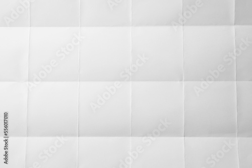 Blank sheet of paper with creases as background, closeup