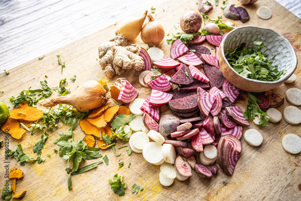 Colorful vegetables ready to use on a cutting board - healthy vegan and vegetarian lifestyle flat lay Colorful vegetables ready to use on a cutting board - healthy vegan and vegetarian lifestyle flat lay