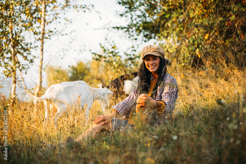 woman in the park. Forest. Smile woman. Goat. Happy day. Forest background. 