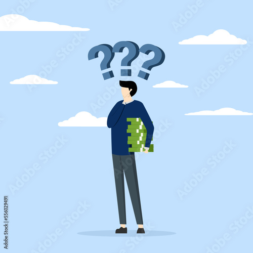 Businessman investor holding money coins thinking about investment, Money question, financial choice or alternative to make decision concept, where to invest, pay off debt or invest for profit.