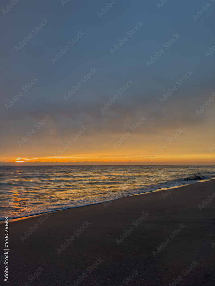 Beautiful sunrise on the Atlantic Ocean. Photo of the ocean. Background.  Vertical photo. Soft focus