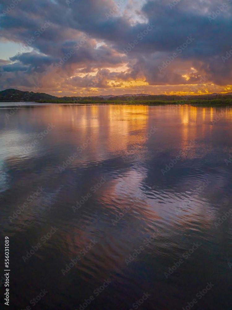 Sunrise over the bay with clouds and reflections Sunrise over the bay with clouds and reflections