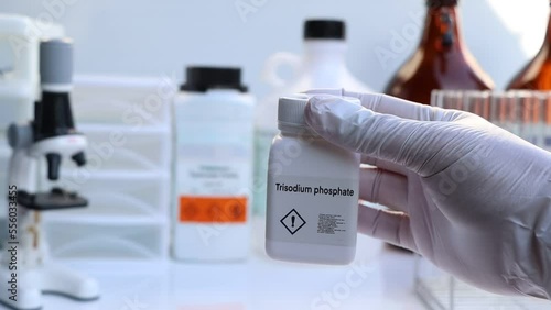 trisodium phosphate in bottle , chemical in the laboratory and industry photo