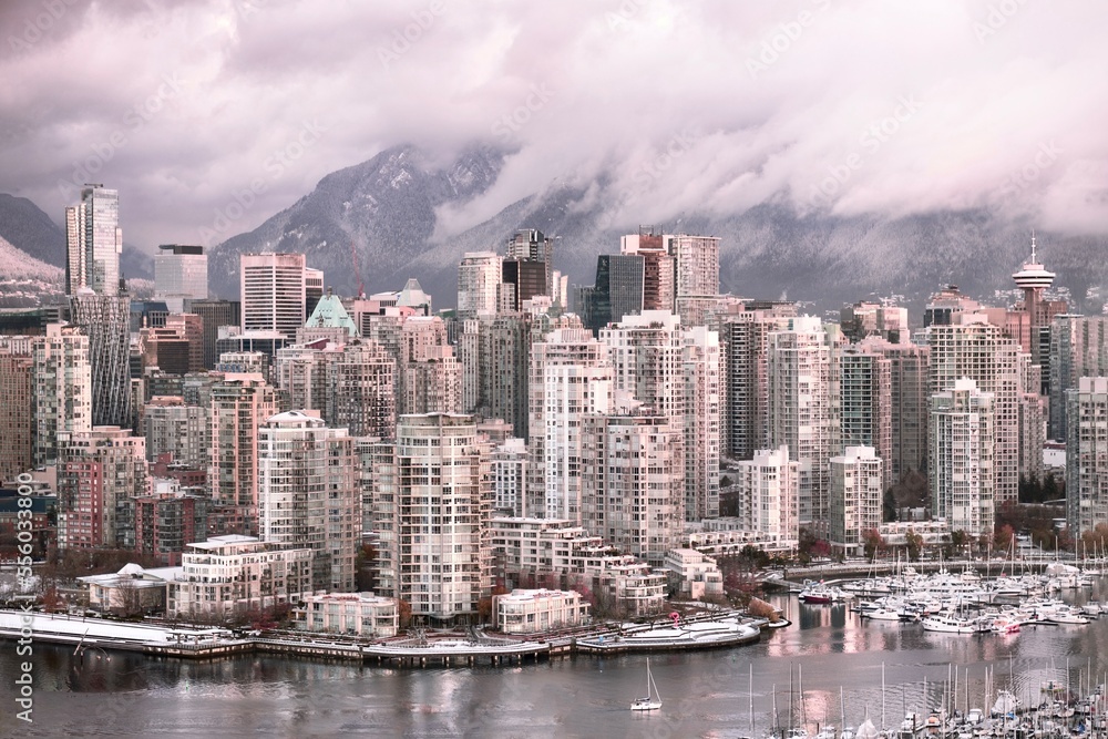 View of Vancouver and Cambie Bridge with mountains covered with snow in the morning light. Yaletown. British Columbia. Canada View of Vancouver and Cambie Bridge with mountains covered with snow in the morning light. Yaletown. British Columbia. Canada