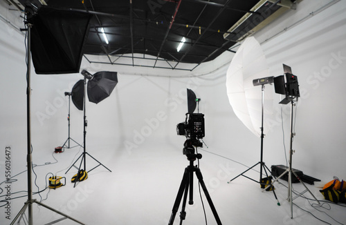 An empty photo Studio with white cyclorama. Monoblocks with flashes using softboxes of different shapes. photographic photography studio space with white cyclorama