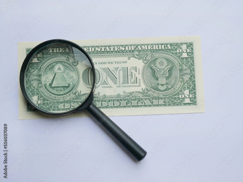 magnifying glass and 1 us dollar bill Stock Photo Adobe Stock