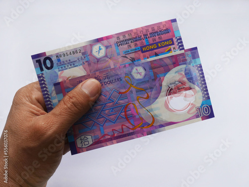 Canvas Print human hand holding 10 hongkong dollars