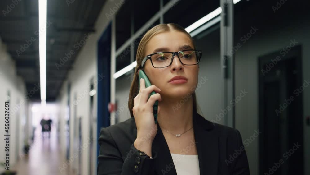 Confident manager speak smartphone corridor closeup. Beautiful ceo walk office Confident manager speak smartphone corridor closeup. Beautiful ceo walk office