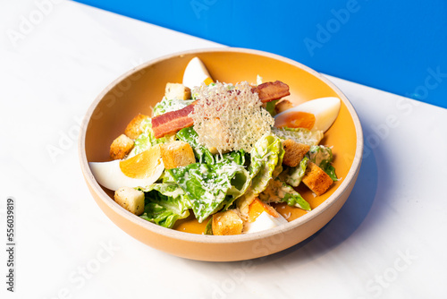 Fototapeta fresh vegetable with boiled egg caesar salad