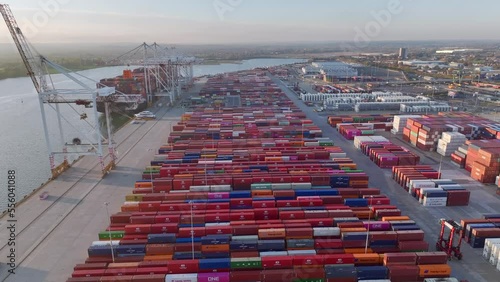 Aerial drone video of the Port of Southampton with hundreds of shipping containers stacked row upon row photo