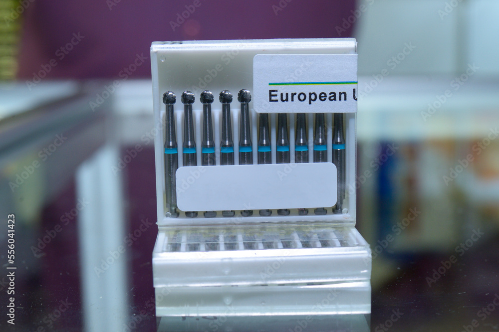 Dental burs packed in plastic package placed on a counter of a shop Dental burs packed in plastic package placed on a counter of a shop