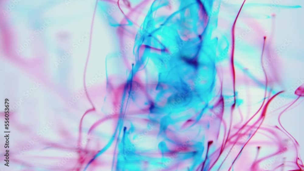 Movement of red blue circles under water on a white background.
Movement of red blue circles under water on a white background.