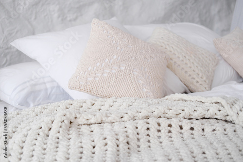 Cozy and fashion place for rest with pillow and knitted plaid