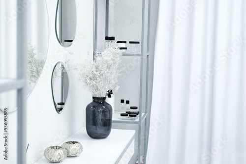 Table with decor in the office of a beauty specialist. Stylish interior