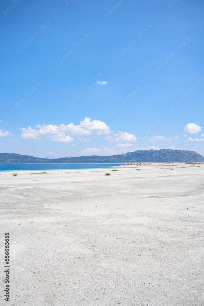The turquoise waters of Salda Lake, the white mineral-rich beach and the blue sky. Salda Lake is a turquoise crater lake.
Salda Lake, Burdur, Turkey