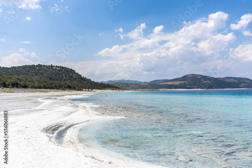 Fototapeta Naklejka Na Ścianę i Meble -  The turquoise waters of Salda Lake, the white mineral-rich beach and the blue sky. Salda Lake is a turquoise crater lake.
Salda Lake, Burdur, Turkey