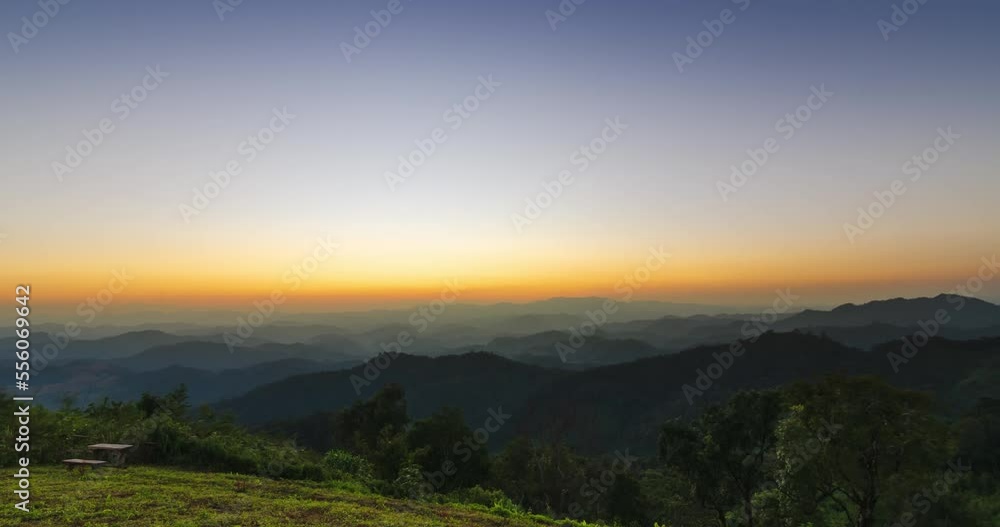 timelapse Sunset in over natural winter mountain range with some cloud fog.Flores tropical paradise. Mountain Range Silhouette Sunrise Sunset Aerial View. timelapse Sunset in over natural winter mountain range with some cloud fog.Flores tropical paradise. Mountain Range Silhouette Sunrise Sunset Aerial View.
