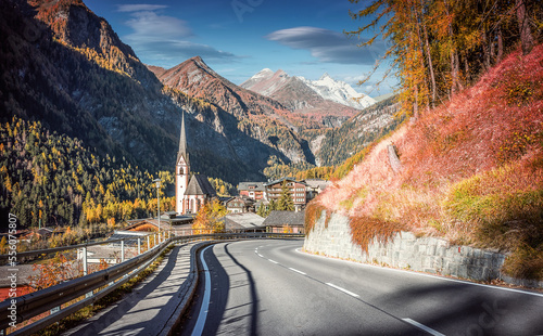 Wonderfu alpine highlands in sunny day. Scenery of nature. Heiligenblut with St Vincent Church in the background the beautiful Grossglockner. Grossglockner High Alpine is most popular place of travel.