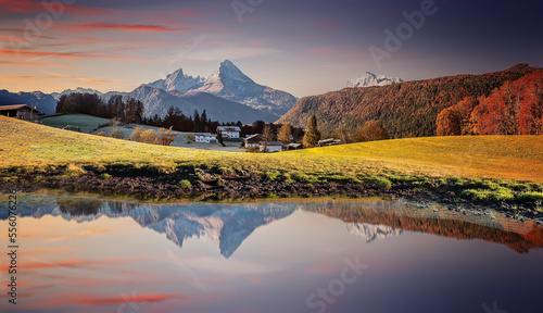 Scenic nature landscape during sunset. Watzmann mount reflection in crystal clear mountain lake on mountain valley. Famous Berchtesgaden land, Bavaria Alps, Germany. Popular travel destination photo