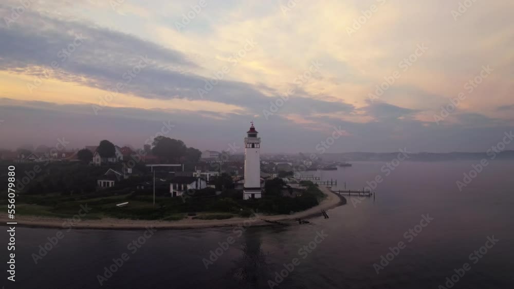 Drone over sea by coastline with lighthouse Drone over sea by coastline with lighthouse