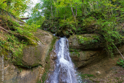 the beginning of autumn, nature walks, a mountain river with waterfalls and a panoramic view of the mountains, hiking trails and recreation in the mountains.*