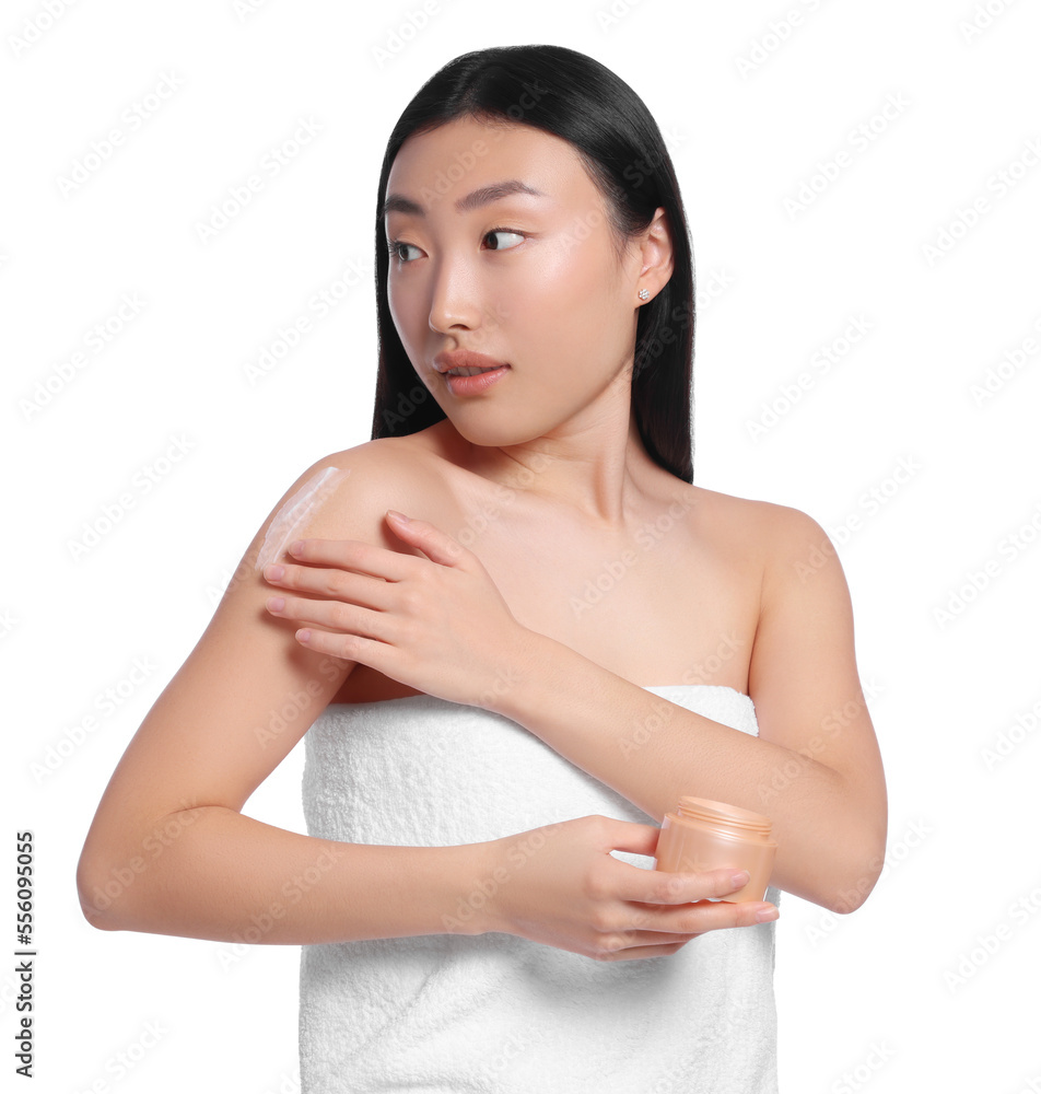 Beautiful young Asian woman applying body cream onto shoulder on white background Beautiful young Asian woman applying body cream onto shoulder on white background